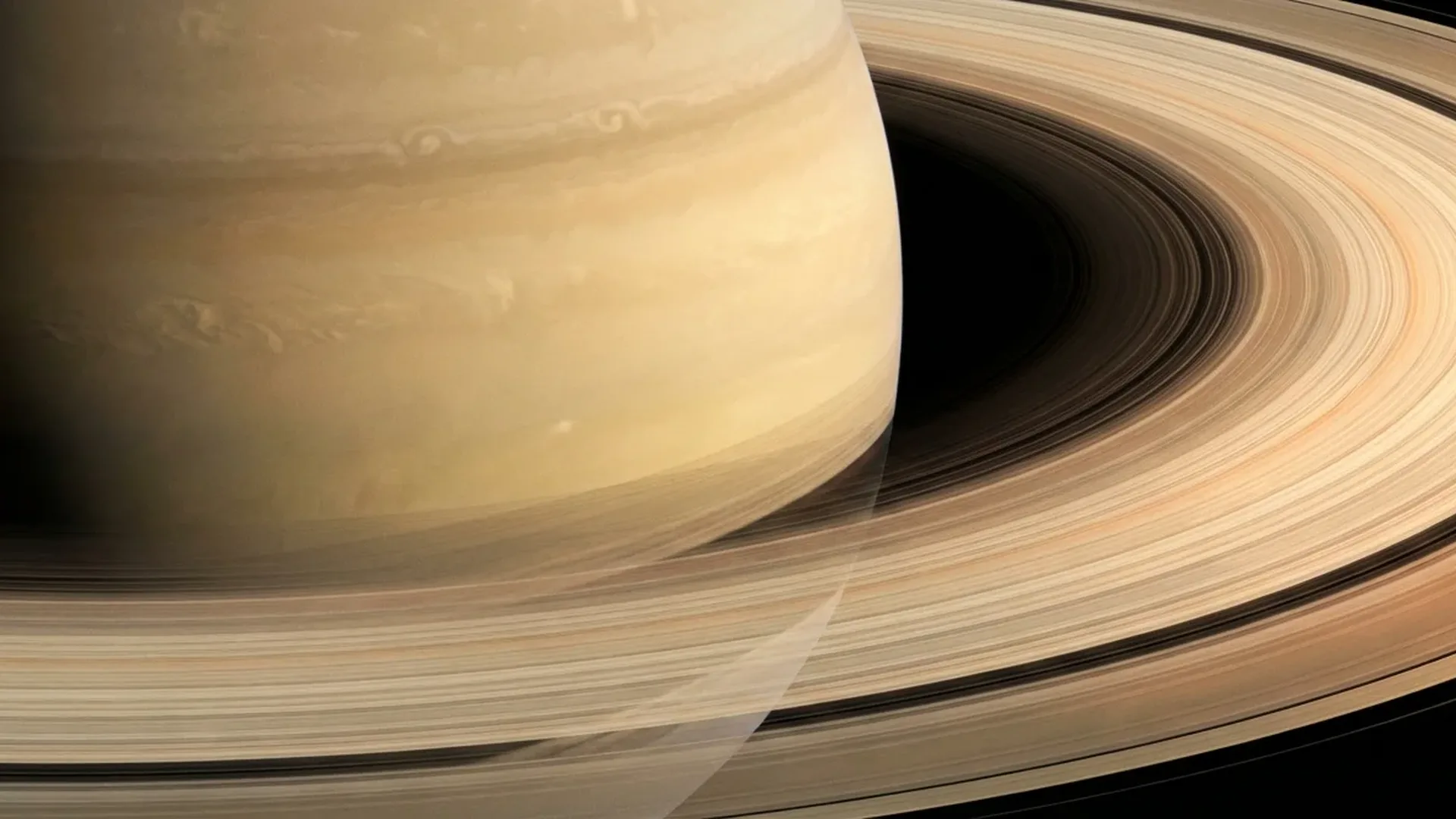 Saturn's magnificent ring system captured by Cassini spacecraft showing intricate details and gaps between ring divisions