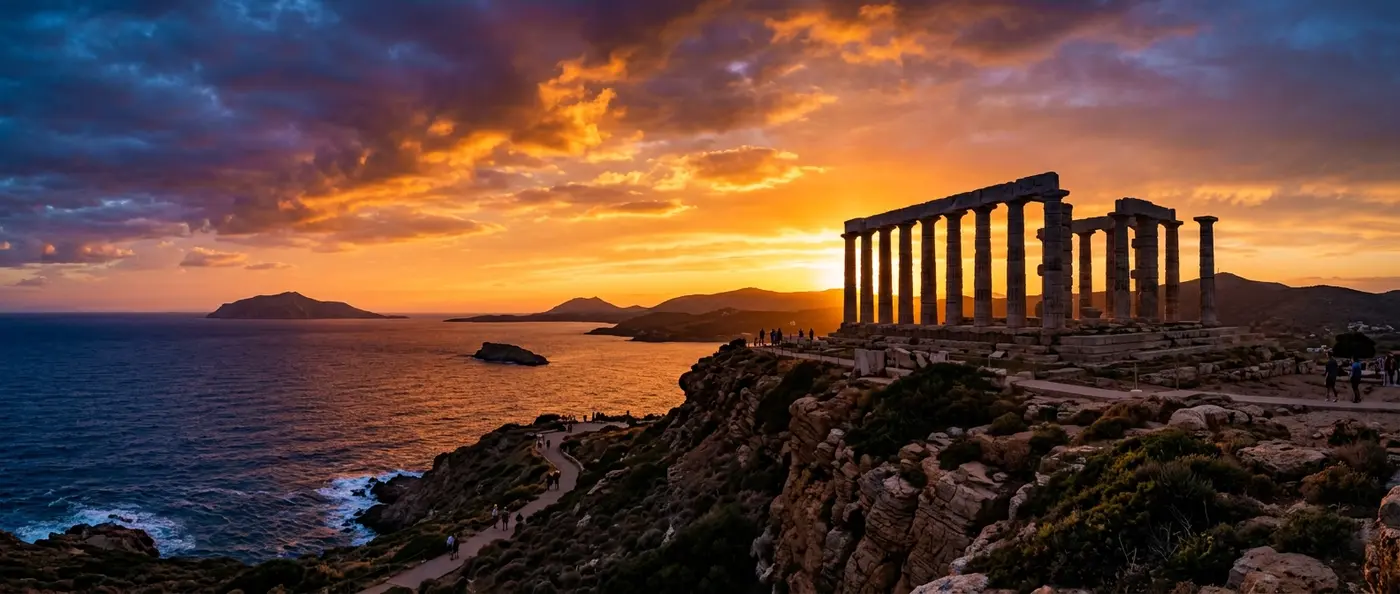 Temple of Poseidon at Cape Sounion with marble columns rising above the Aegean Sea at sunset